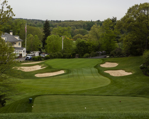 Pine Brook Country Club fairway with clubhouse background